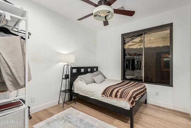 bedroom featuring ceiling fan and light wood-type flooring