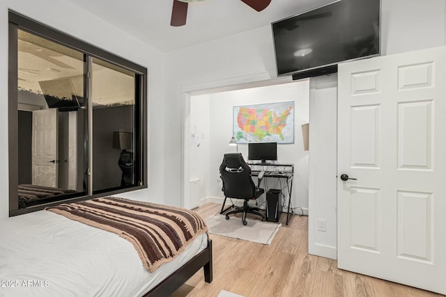 bedroom featuring hardwood / wood-style flooring and ceiling fan