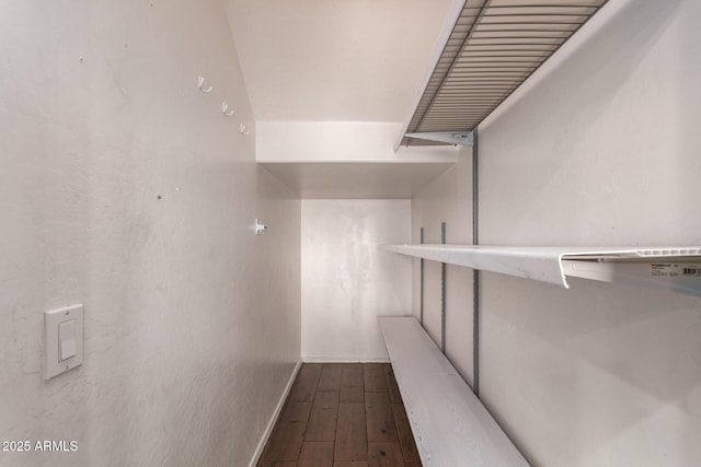 spacious closet with wood finished floors