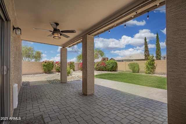 view of patio featuring a fenced backyard and ceiling fan