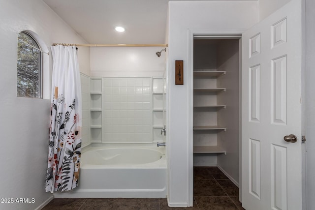 bathroom featuring tile patterned flooring and shower / bath combo