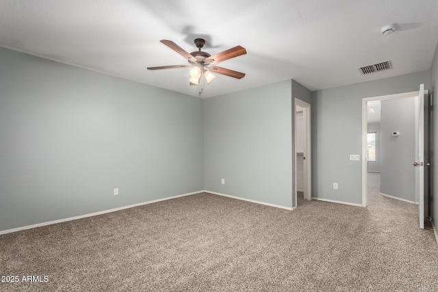 unfurnished bedroom with a ceiling fan, baseboards, visible vents, and carpet