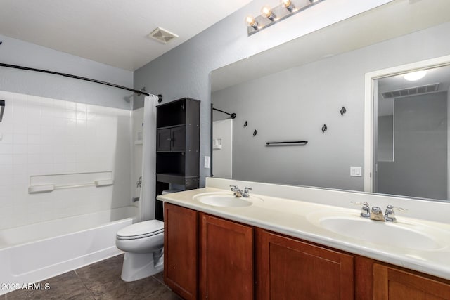 full bathroom featuring a sink, toilet, and visible vents