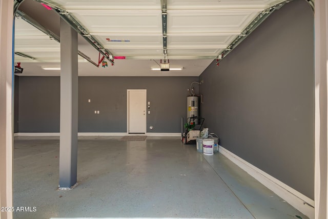 garage with baseboards, a garage door opener, and water heater
