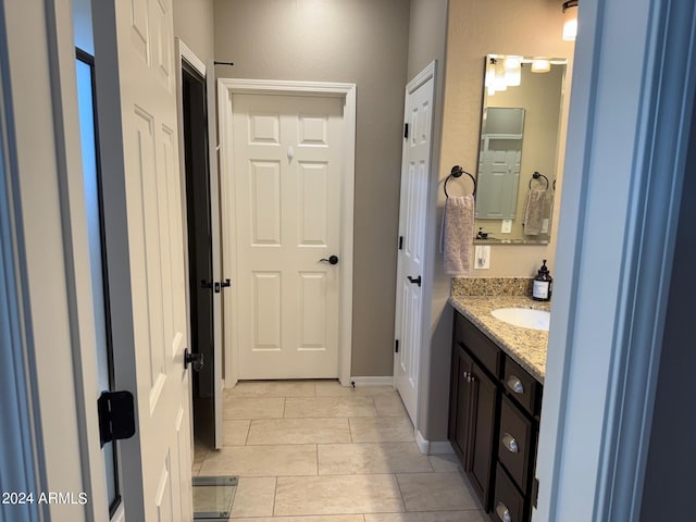 bathroom with tile patterned floors and vanity