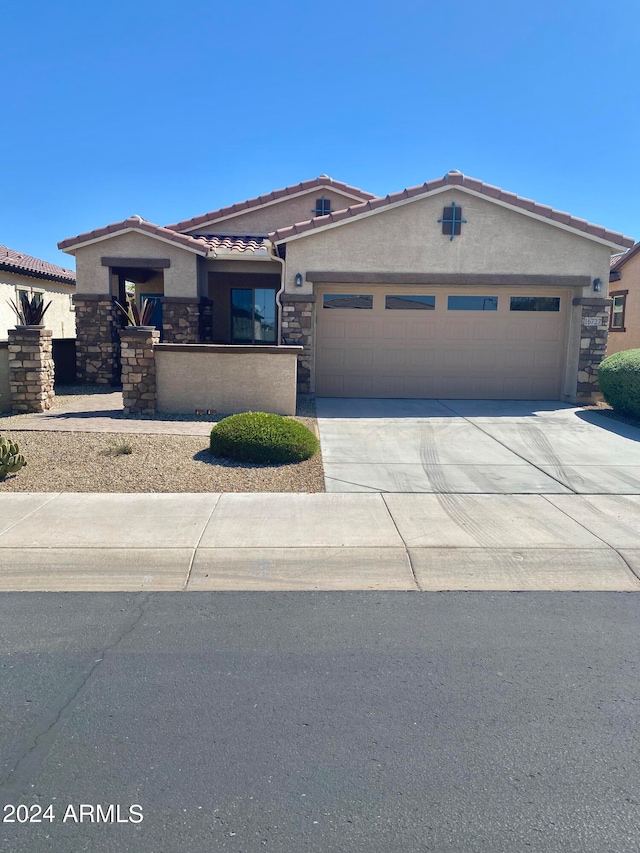 view of front of property with a garage