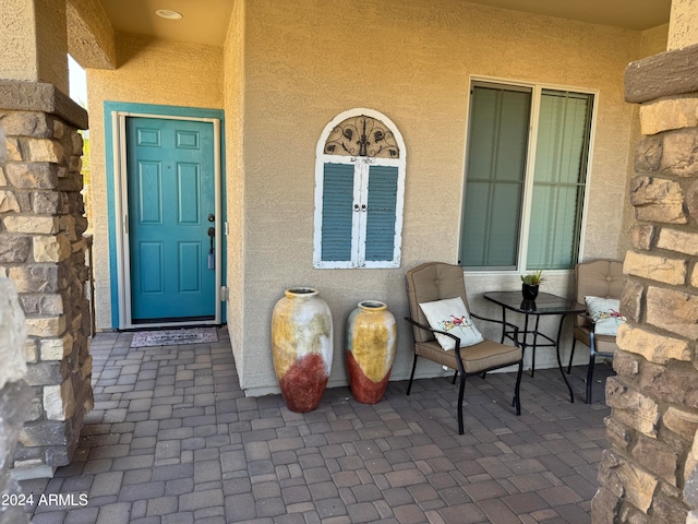 doorway to property featuring covered porch