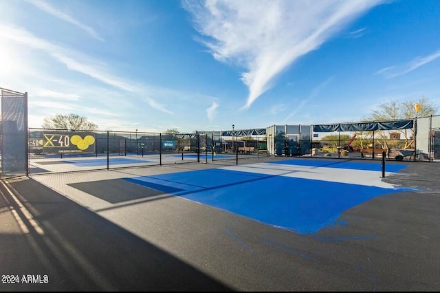 view of sport court featuring tennis court