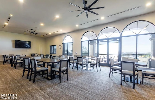 dining area featuring carpet flooring and ceiling fan