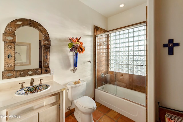 full bathroom featuring bath / shower combo with glass door, vanity, toilet, and a healthy amount of sunlight