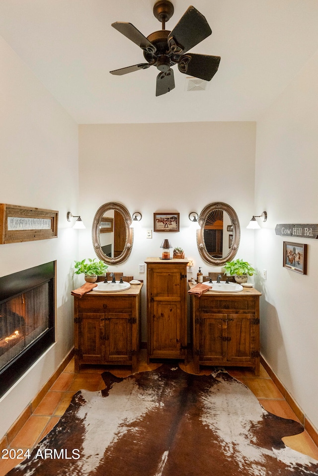 bathroom with tile patterned floors, ceiling fan, and vanity