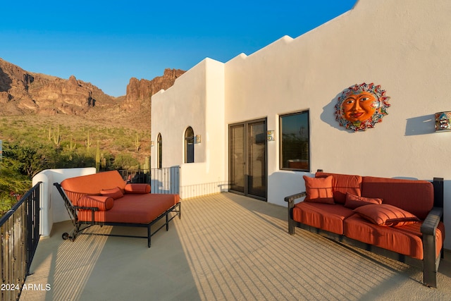 view of patio with a mountain view and an outdoor hangout area