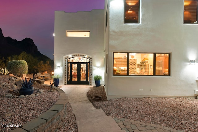 exterior entry at dusk with french doors