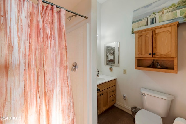 bathroom with vanity, toilet, and a shower with shower curtain