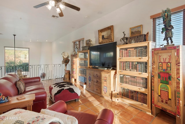 living room with ceiling fan and light tile patterned floors