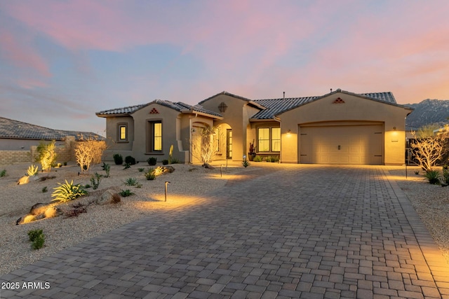 mediterranean / spanish house featuring a garage