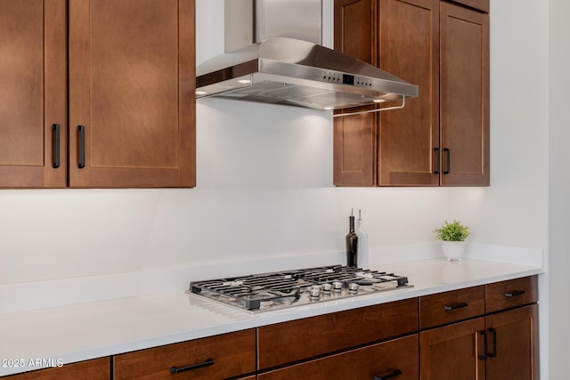 kitchen featuring stainless steel gas cooktop and extractor fan