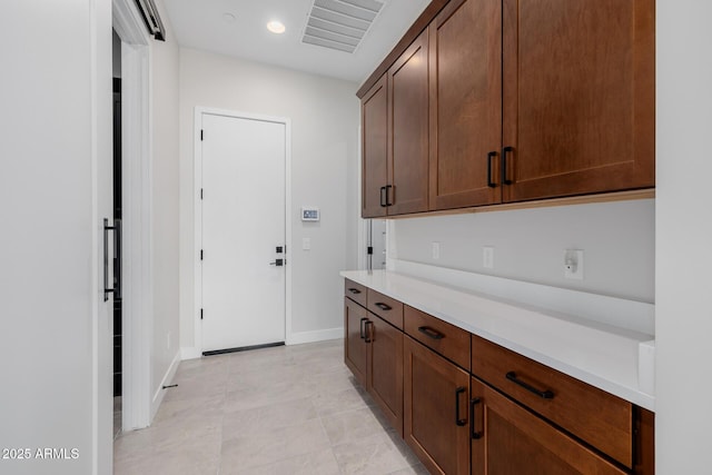 kitchen with light tile patterned floors