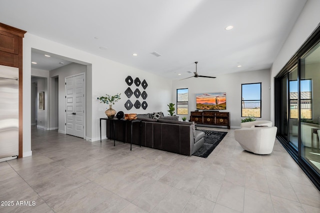 living room featuring ceiling fan