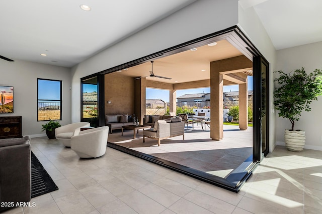 interior space featuring ceiling fan