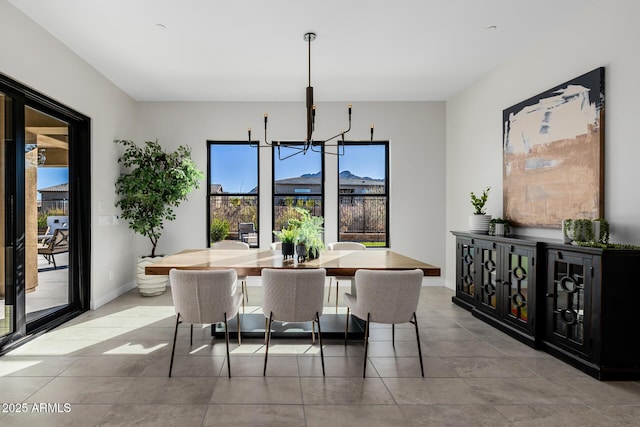 dining space featuring a notable chandelier