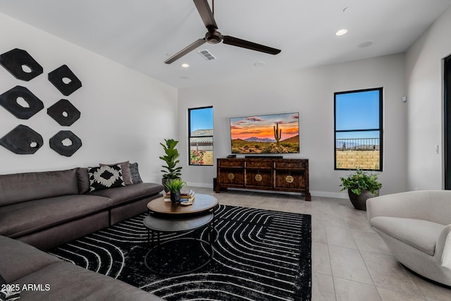 living room with ceiling fan and light tile patterned floors