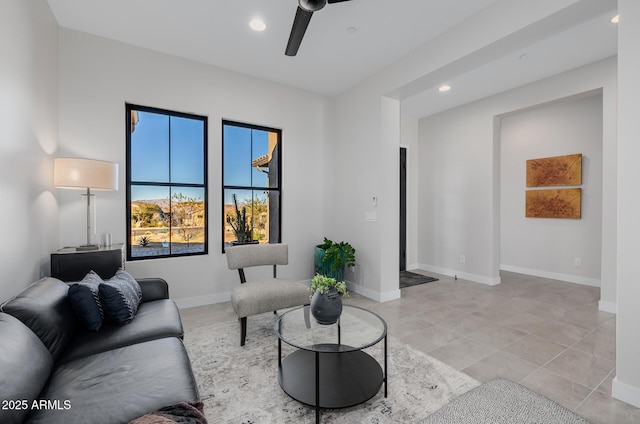 living room with ceiling fan and light tile patterned floors