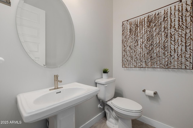 bathroom featuring sink and toilet