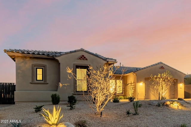 mediterranean / spanish-style house featuring a garage