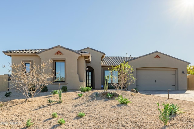 mediterranean / spanish-style house featuring a garage