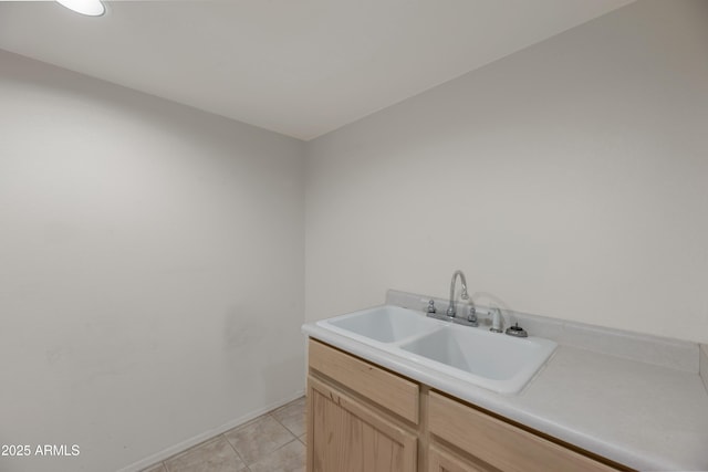 interior space featuring sink and light tile patterned floors