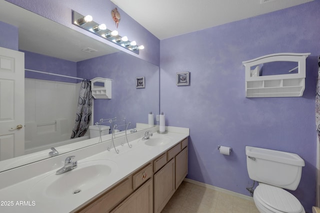 full bathroom featuring vanity, shower / bath combo, and toilet