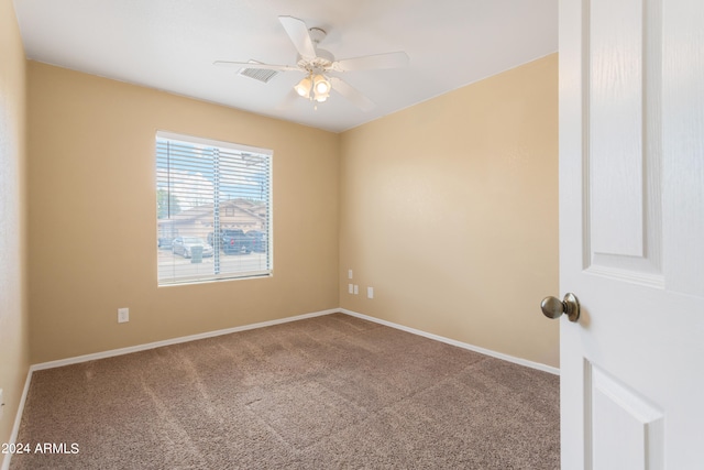 unfurnished room featuring ceiling fan and carpet floors