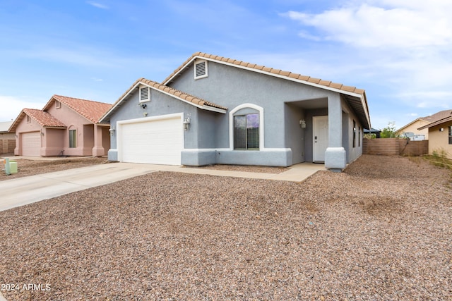 view of front of home with a garage