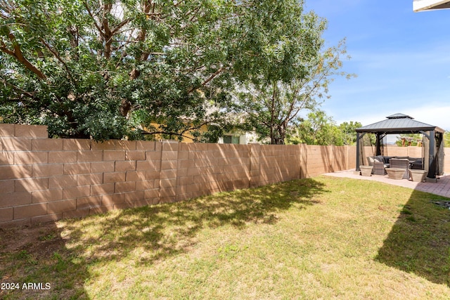 view of yard featuring a patio, a gazebo, and an outdoor living space