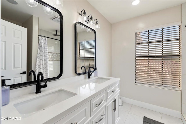 16008 N 56th Way, Scottsdale, AZ 85254 - full bath featuring tile patterned flooring, double vanity, baseboards, and a shower with shower curtain