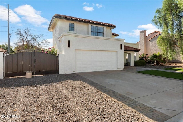 16008 N 56th Way, Scottsdale, AZ 85254 - mediterranean / spanish home featuring concrete driveway, a tile roof, stucco siding, and an attached garage