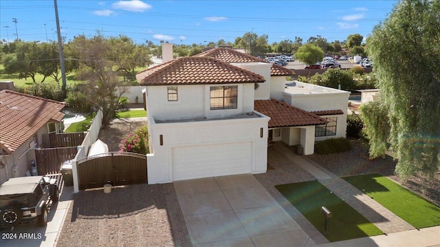 16008 N 56th Way, Scottsdale, AZ 85254 - view of front of house featuring a tile roof, an attached garage, stucco siding, a gate, and a chimney