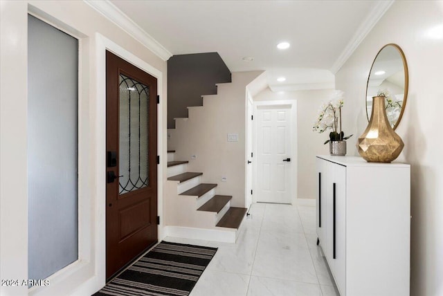 entryway featuring crown molding