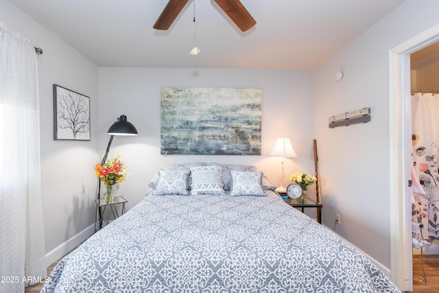 bedroom with wood-type flooring and ceiling fan