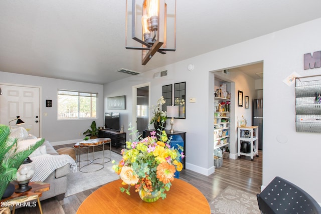 living room with dark hardwood / wood-style floors and ceiling fan