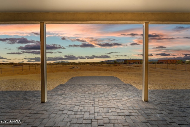 view of patio terrace at dusk