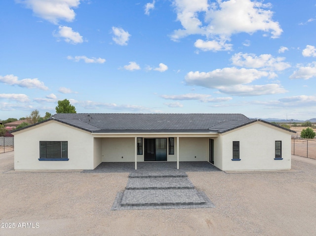 back of house with a patio