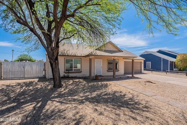 12613 N 51st Dr, Glendale, AZ 85304 - ranch-style home with driveway, a garage, a porch, a gate, and roof with shingles