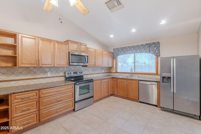 12613 N 51st Dr, Glendale, AZ 85304 - kitchen with stainless steel appliances, a sink, open shelves, decorative backsplash, and lofted ceiling