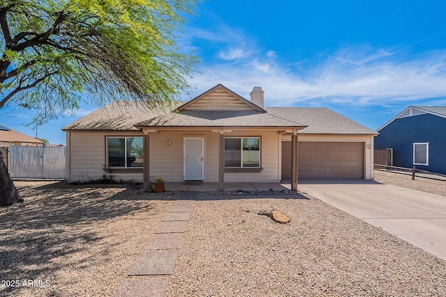 12613 N 51st Dr, Glendale, AZ 85304 - view of front of home with driveway, a garage, a chimney, roof with shingles, and a gate