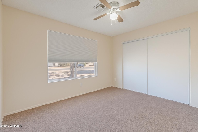 12613 N 51st Dr, Glendale, AZ 85304 - unfurnished bedroom featuring carpet floors, a closet, a ceiling fan, and baseboards