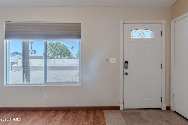 12613 N 51st Dr, Glendale, AZ 85304 - foyer entrance featuring plenty of natural light, baseboards, and light wood finished floors