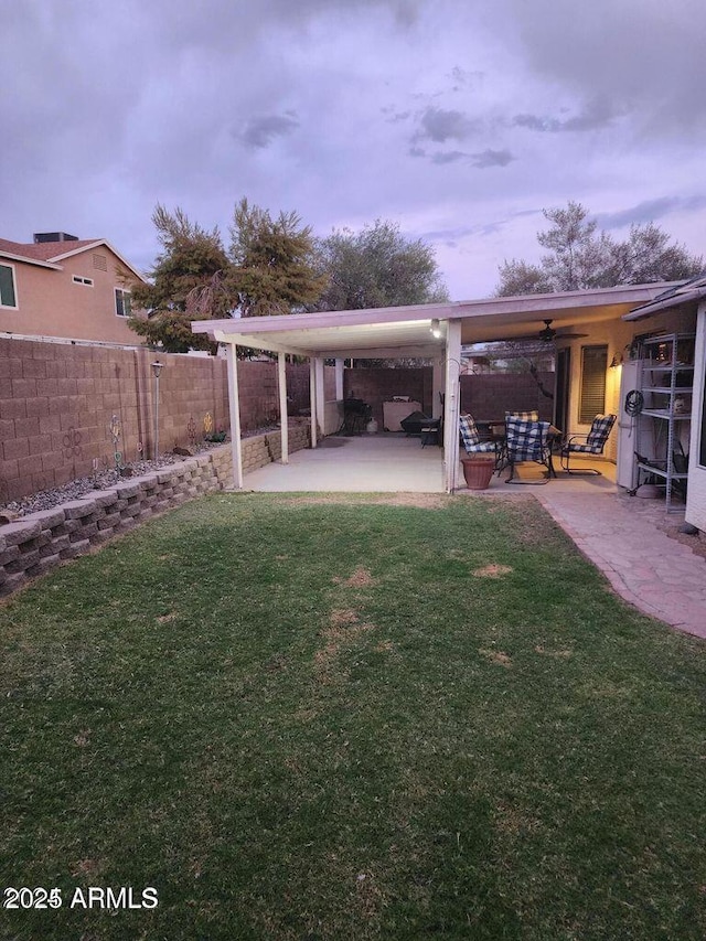 view of yard with a patio and fence