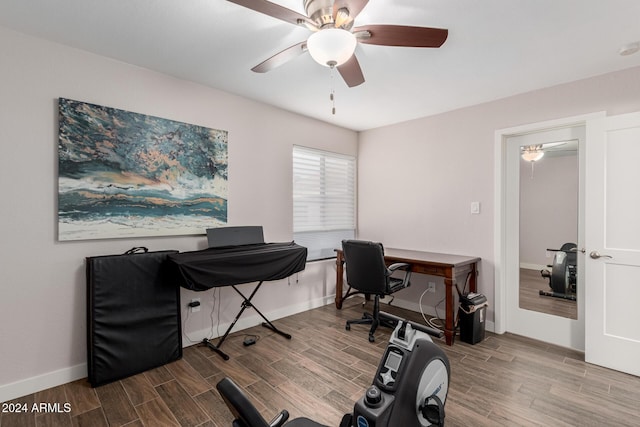 office with wood-type flooring and ceiling fan